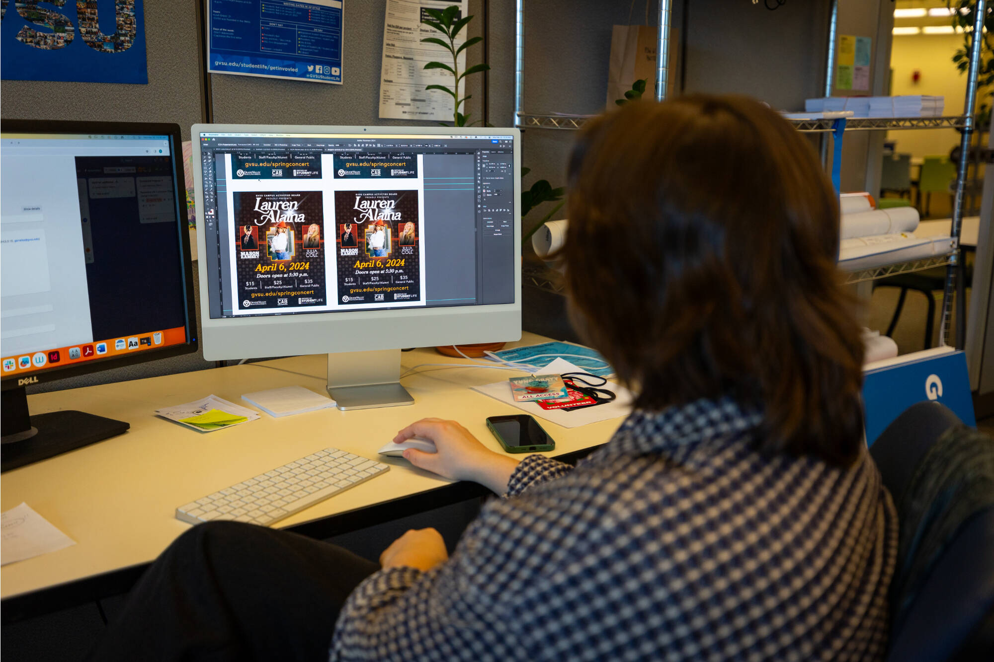 A graphic design student working at a computer